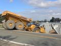 Construction dump truck working on river