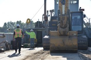 Construction workers overseeing worksite