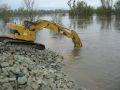 Construction excavator working in water wetlands 