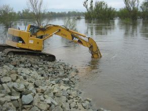 Construction excavator working in water wetlands 